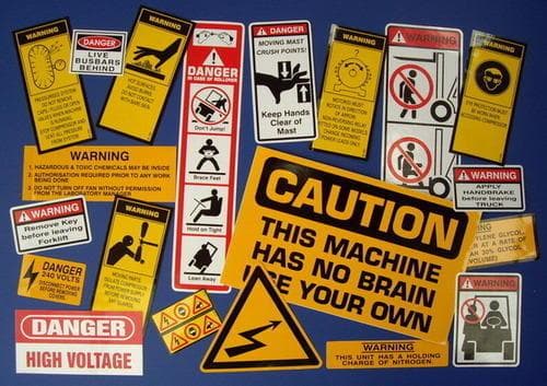 Safety compliance label with hazard symbols