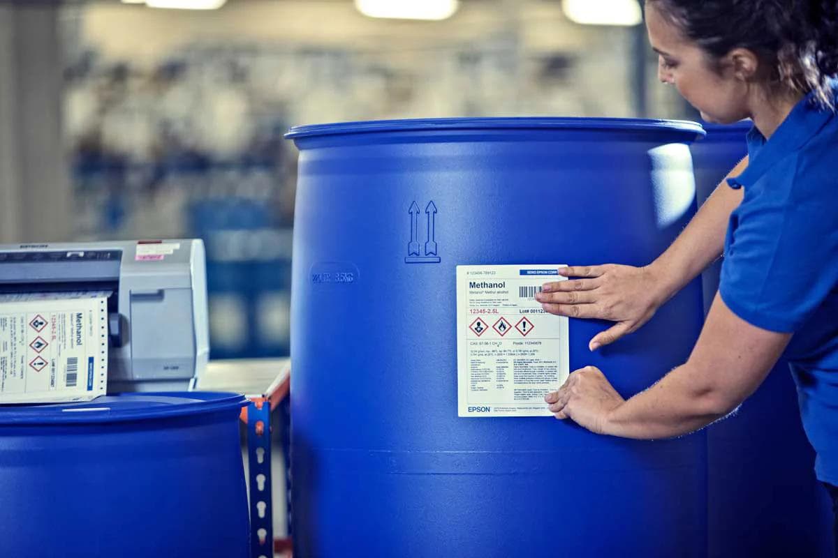 Chemical container label with hazard markings