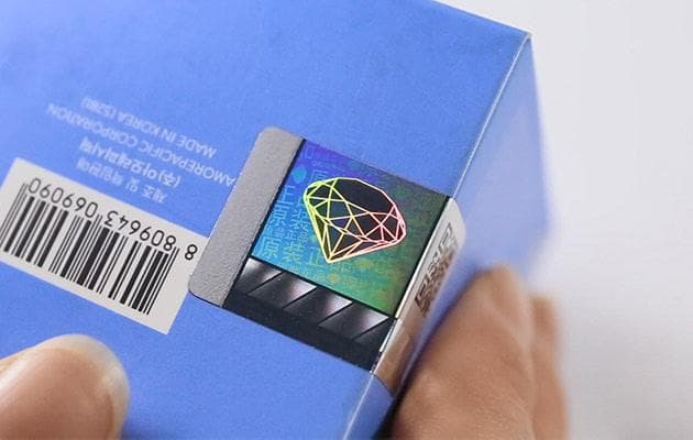Anti-counterfeit hologram sticker close-up detail
